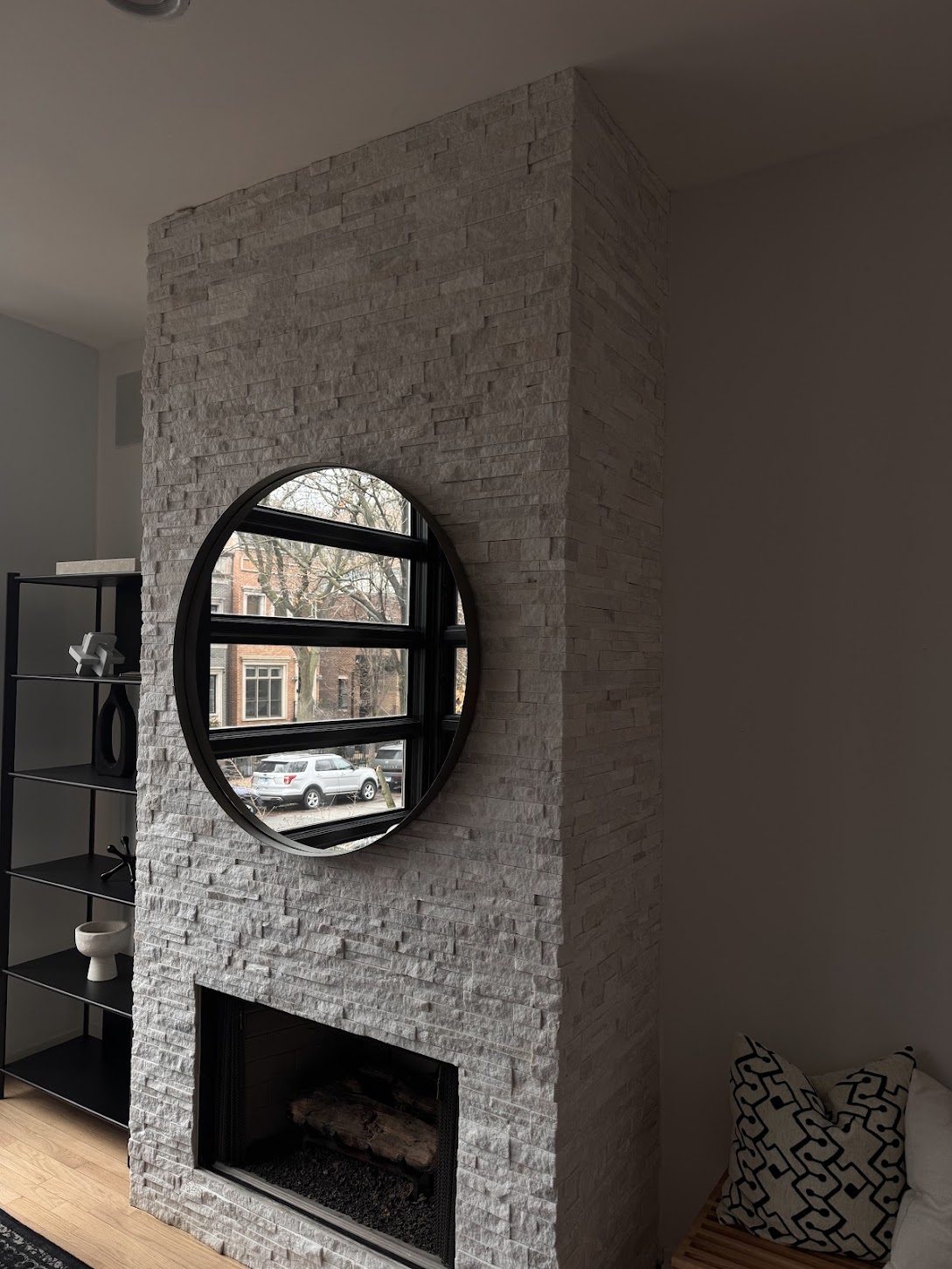 Finished interior with a painted wall and stone fireplace
