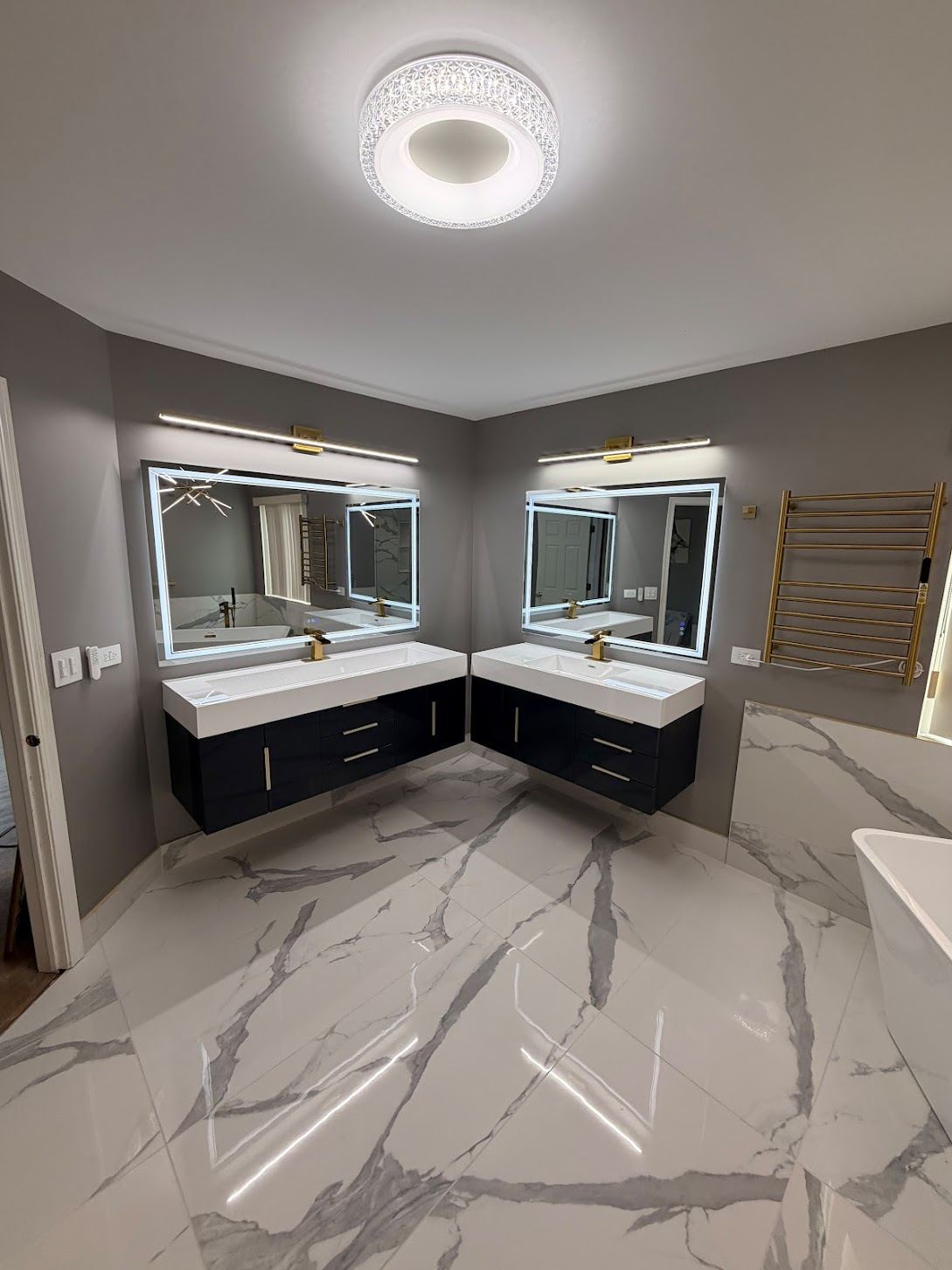 Finished bathroom with tiled floor and double vanity